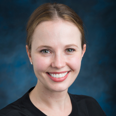 Elizabeth Wimberly-Young headshot on blue background
